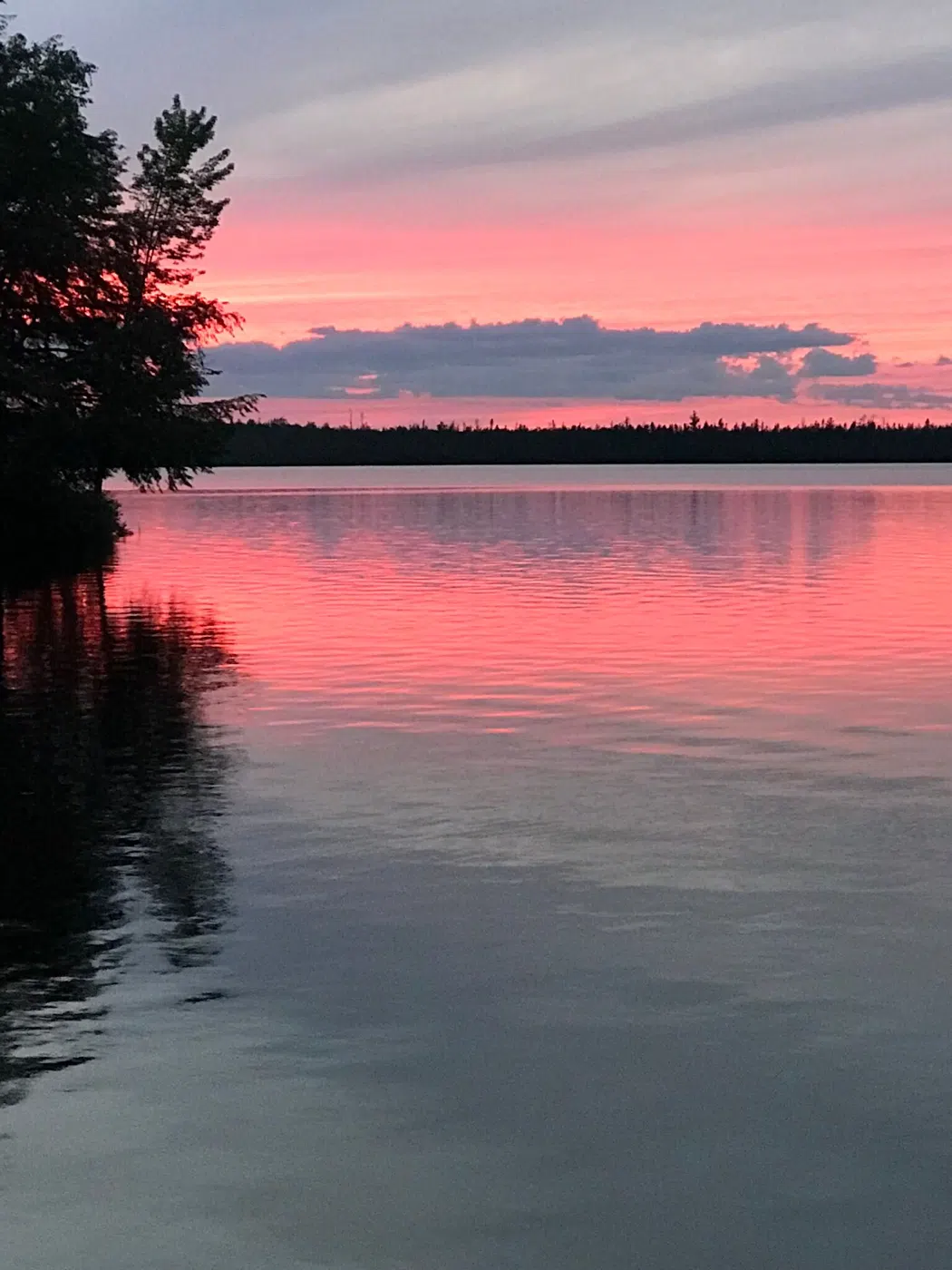 Sunset over calm Maine water