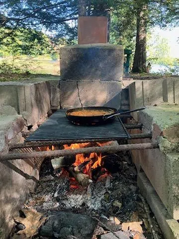 Shore lunch cooking over an open fire